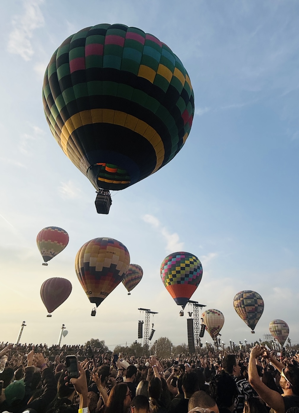 Hot air balloons rising over the crowd at Black Coffee's set at the Mayan Pyramids